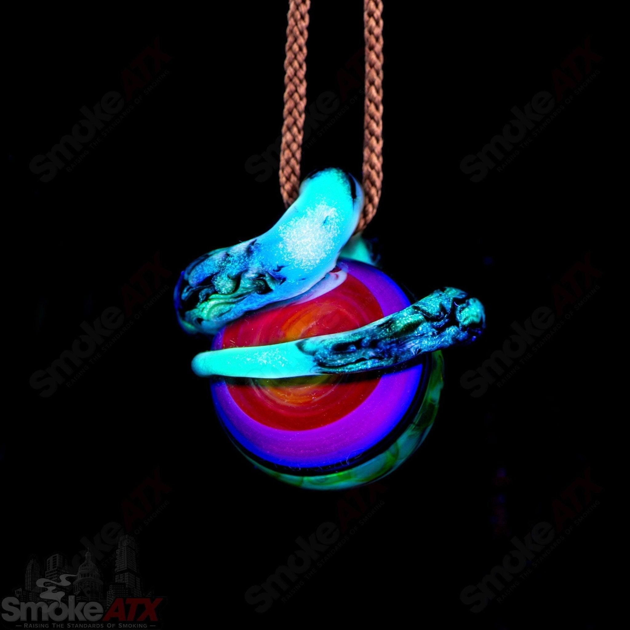 Kengtaro Python Pendant made of colorful heady glass, featuring a detailed glass python design hanging from a cord.