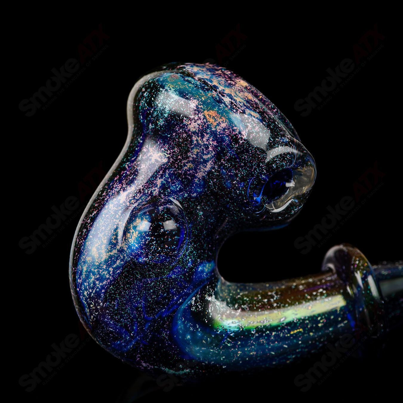 JMass Quasar Tech Sherlock heady glass pipe by Melodium featuring a detailed Sherlock design and clear glass construction.