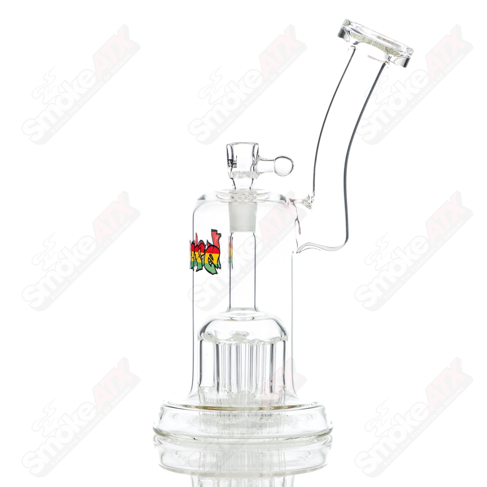 Leisure Glass Rasta 44 Mag Leisure concentrate rig with colorful Rasta design and glass construction for dabbing.