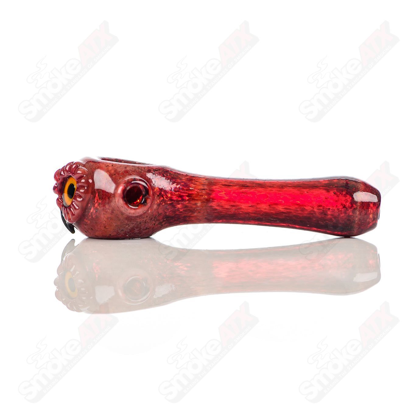 Red spotted owl glass spoon pipe by Four Winds Flameworks, featuring intricate owl design and vibrant red spots.