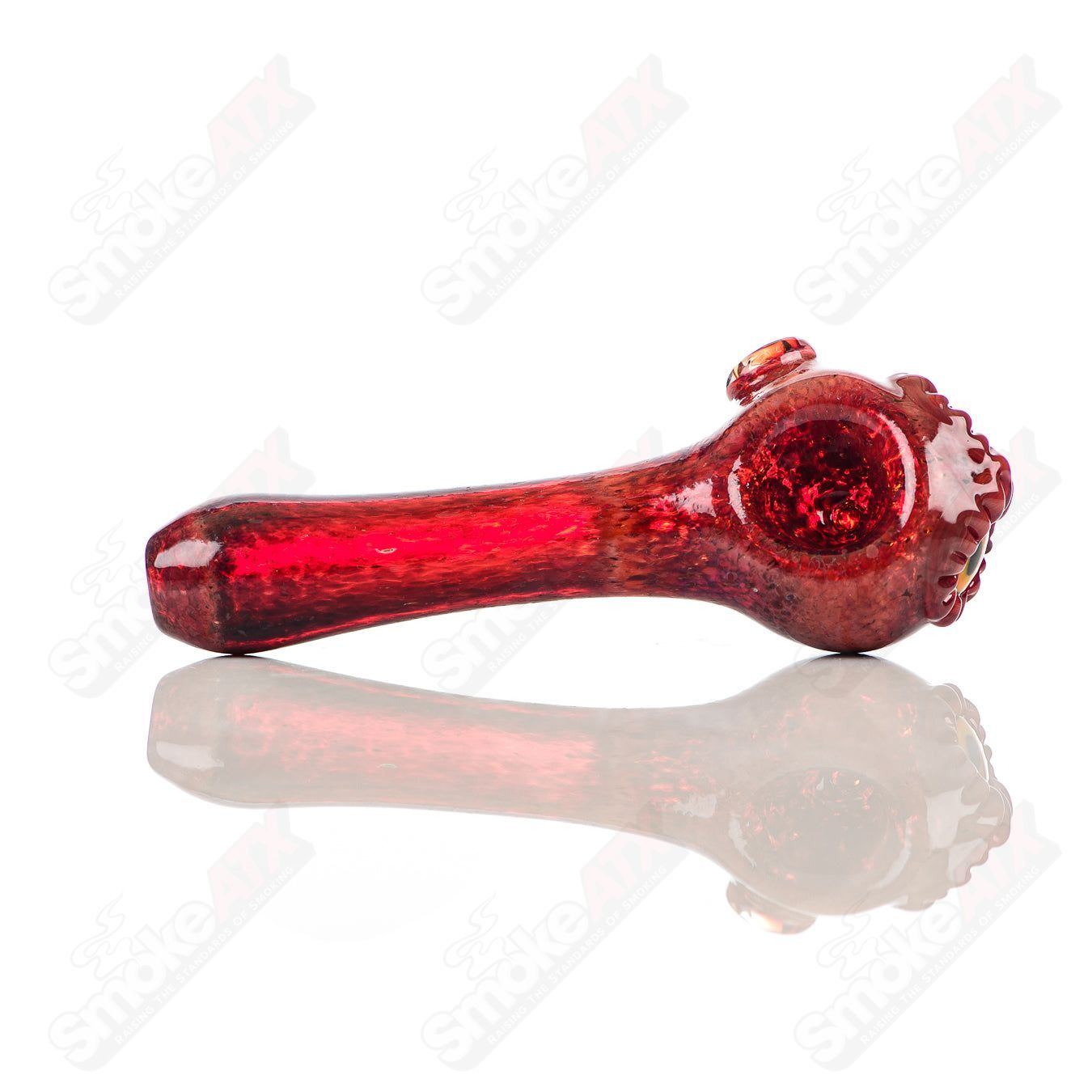 Red spotted owl glass pipe by Four Winds Flameworks featuring detailed owl design and vibrant red spots on clear glass.