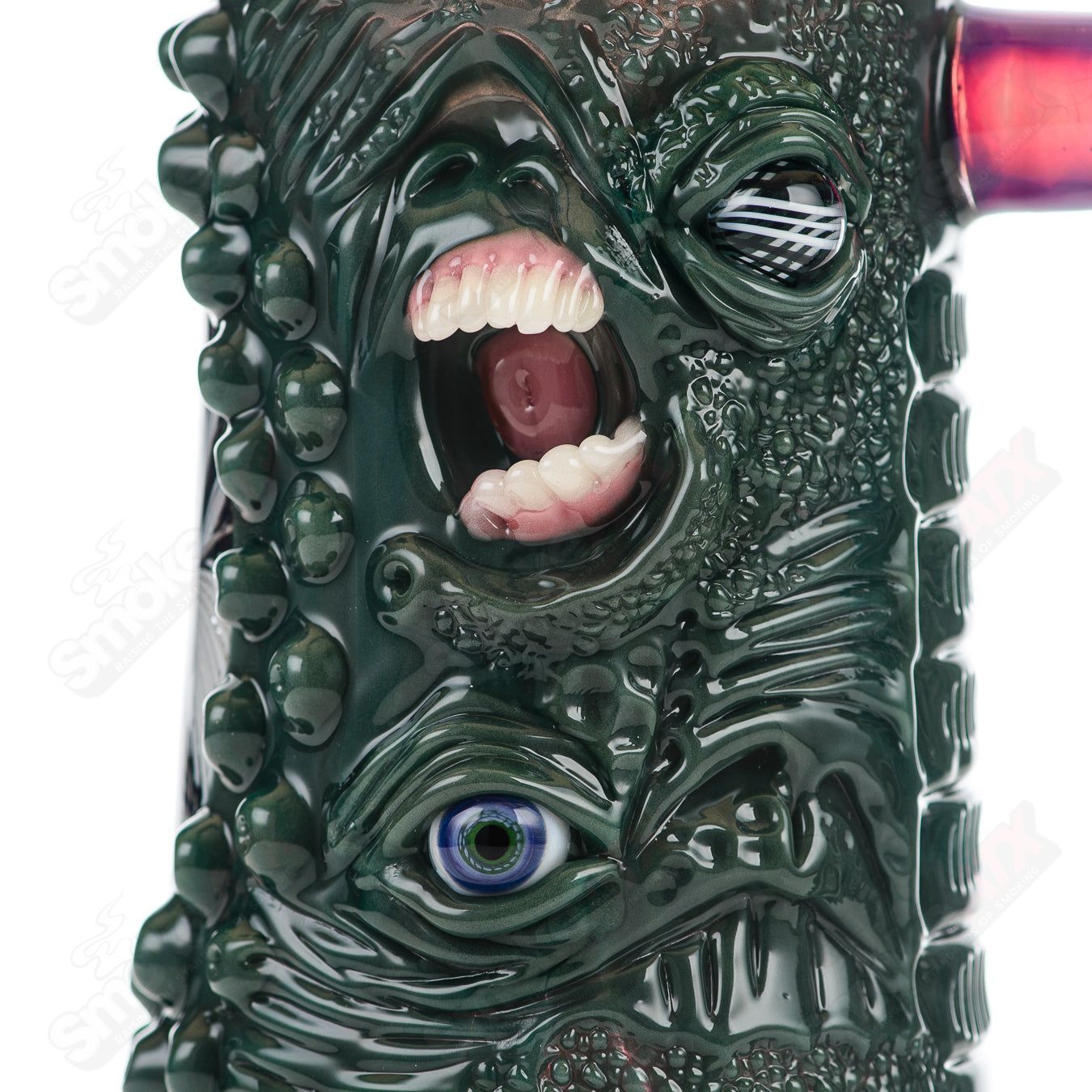 Reticello Many Face Drinking Mug by Salt Glass, a colorful heady glass cup with intricate reticello pattern and multiple facial designs.