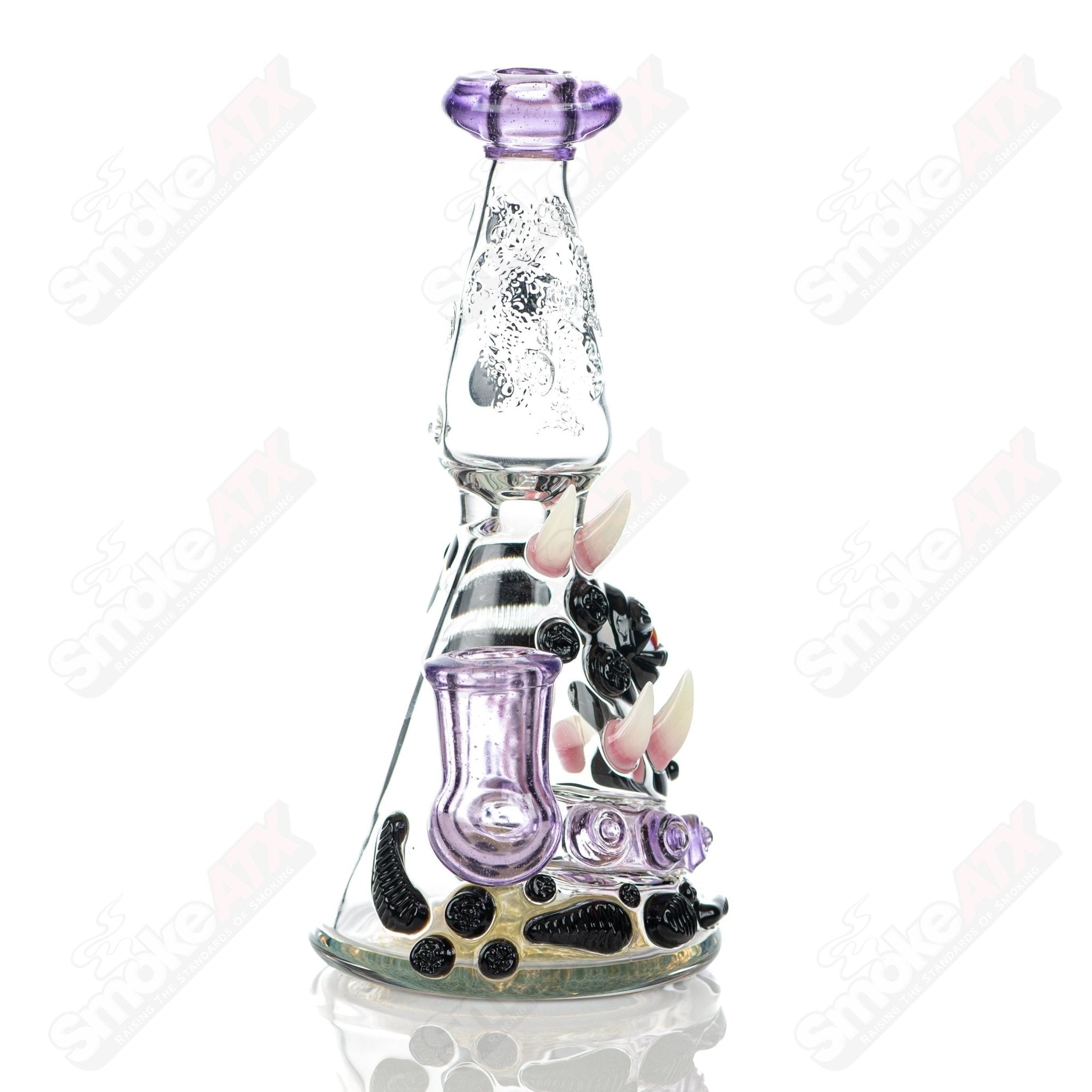 RipCurl by Helix & Salt Glass heady concentrate rig with intricate glasswork and vibrant colors for premium dabbing experience.