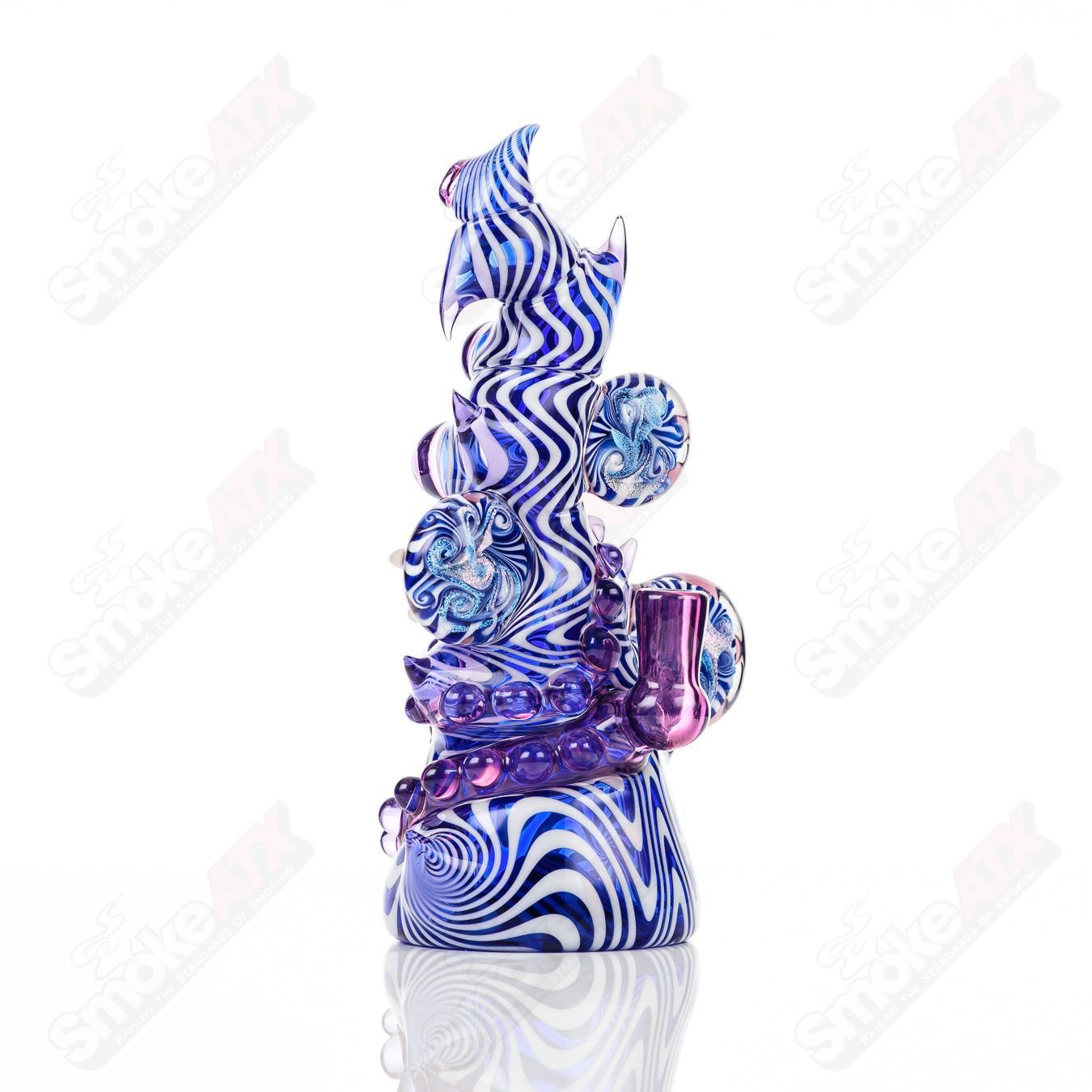 Saltacc Brackish RipCurl by Galactic Glass x Salt Glass, a colorful concentrate rig with intricate glasswork and detailed design.