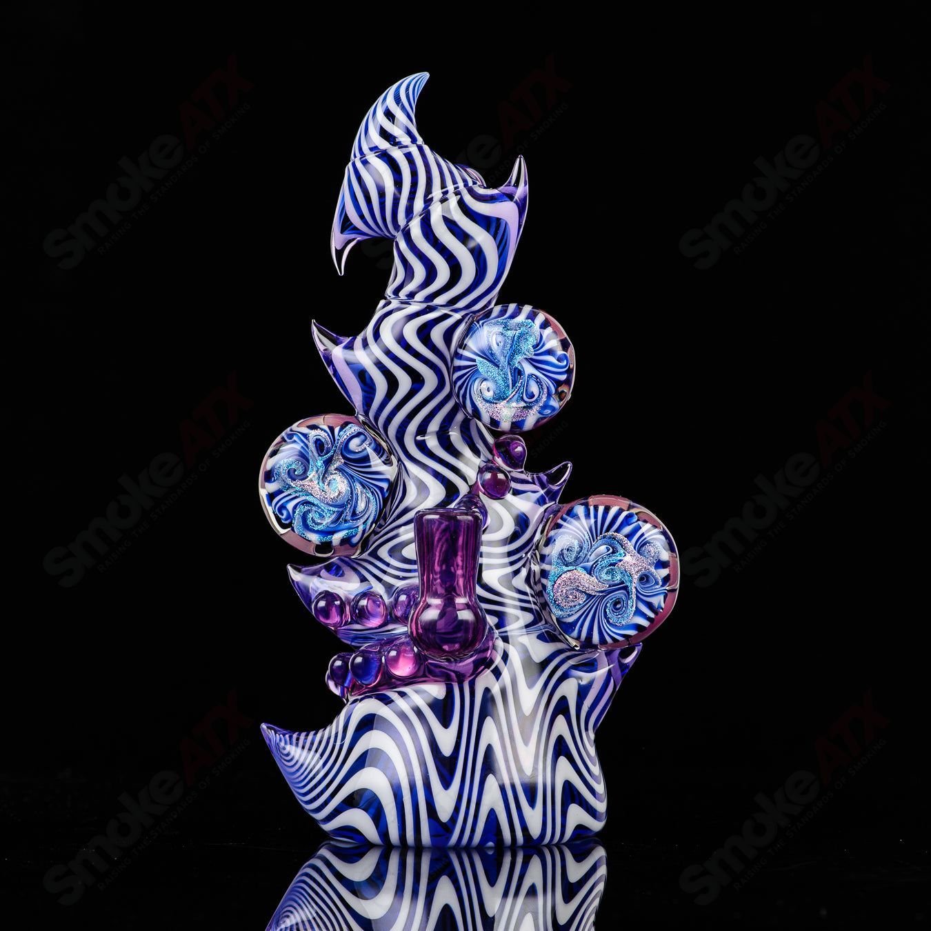 Saltacc Brackish RipCurl heady glass concentrate rig by Salt Glass, featuring intricate design and vibrant glasswork.