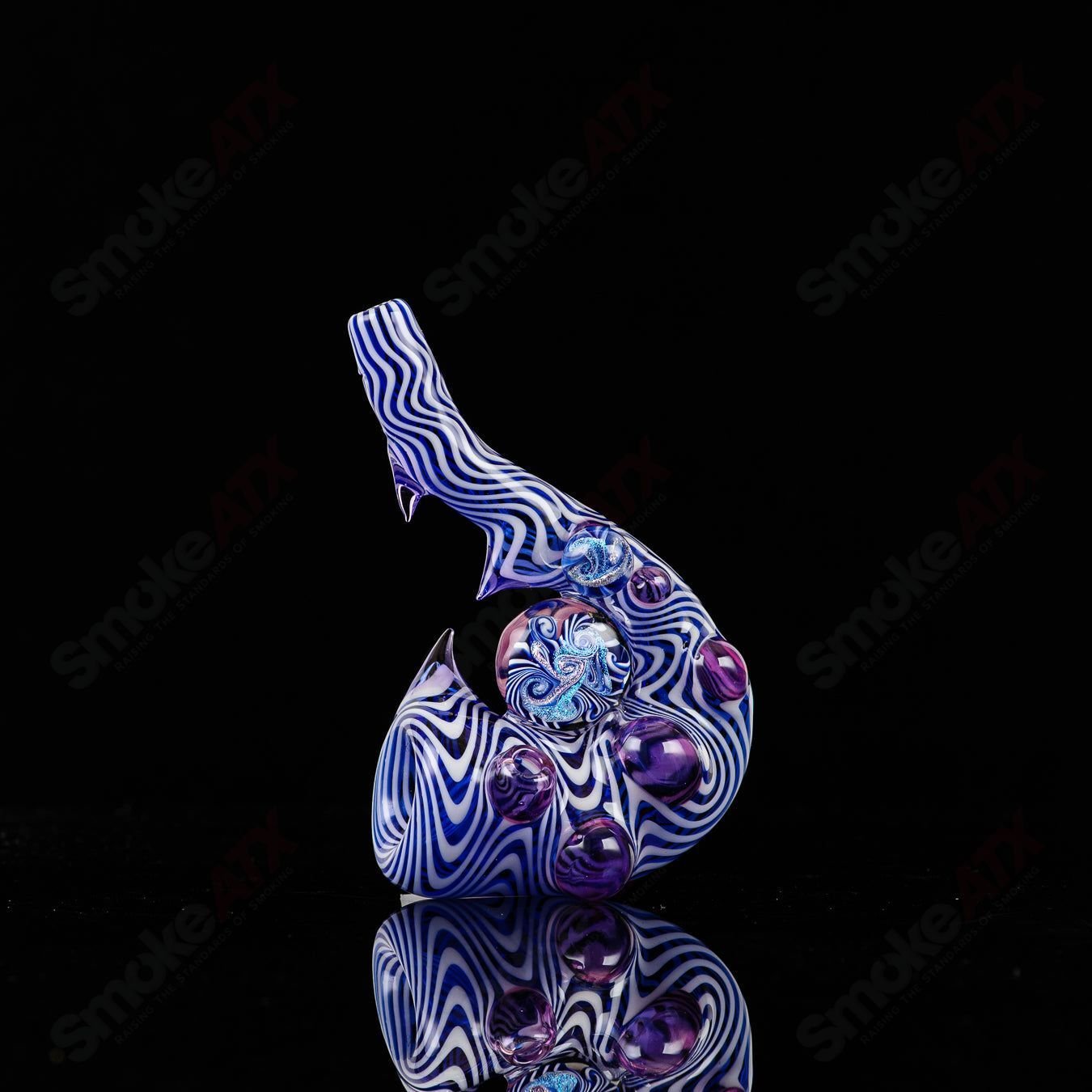 Sherlock heady glass in cobalt blue, star white, and royal jelly colors by Salt Glass, featuring a galactic design.