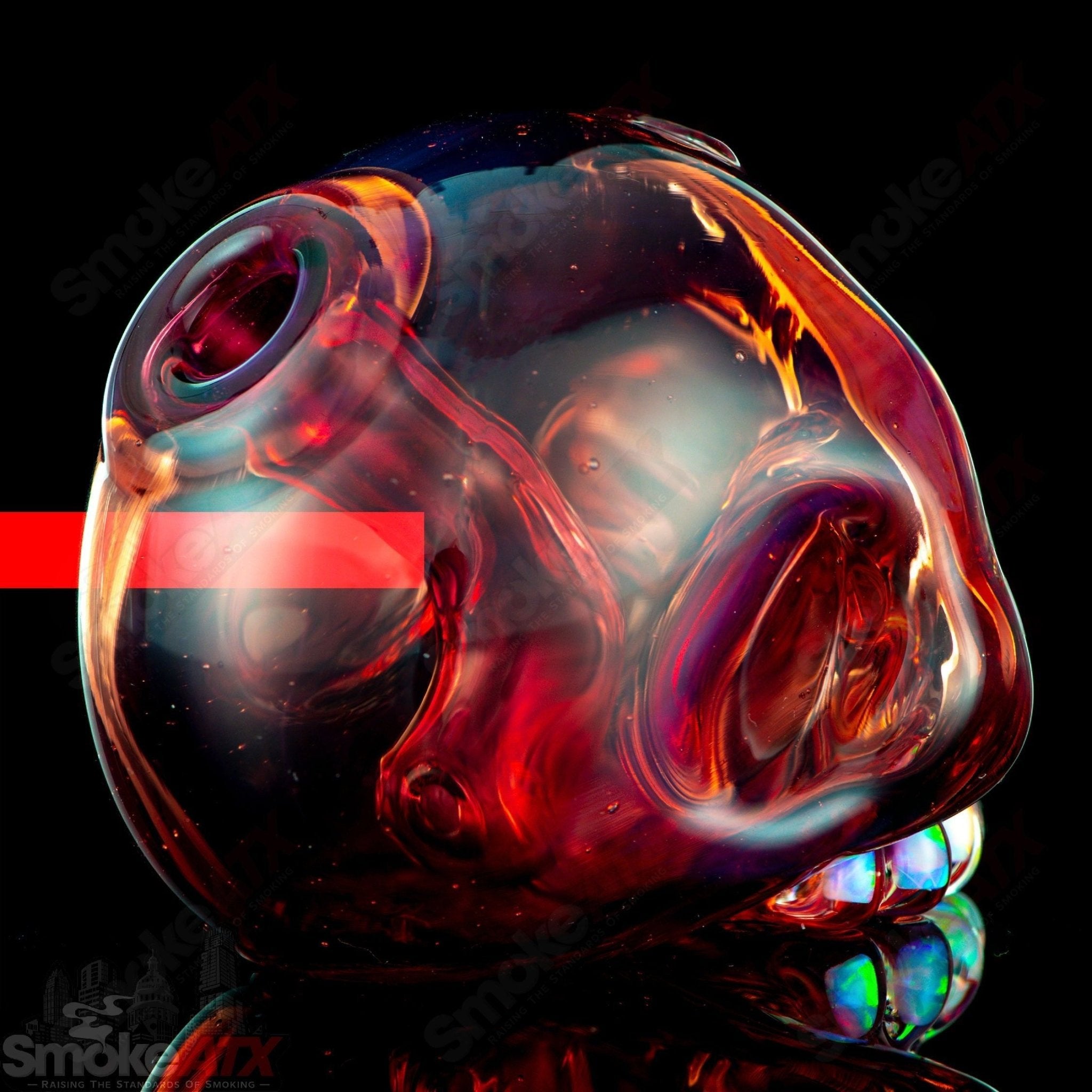 Carsten Carlile Skull Shredder heady glass concentrate rig with intricate skull design and vibrant colors.