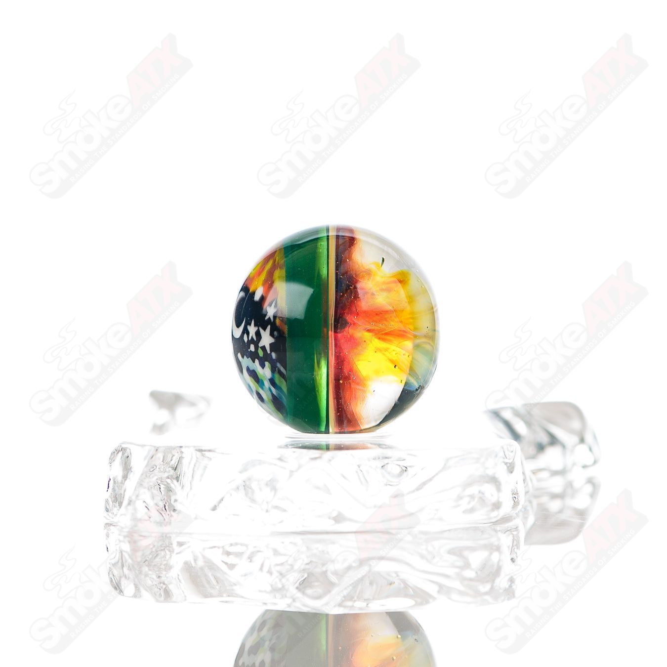 Heady glass Slurper marble by Phil Siegel, featuring intricate swirling patterns and vibrant colors on a clear glass background.