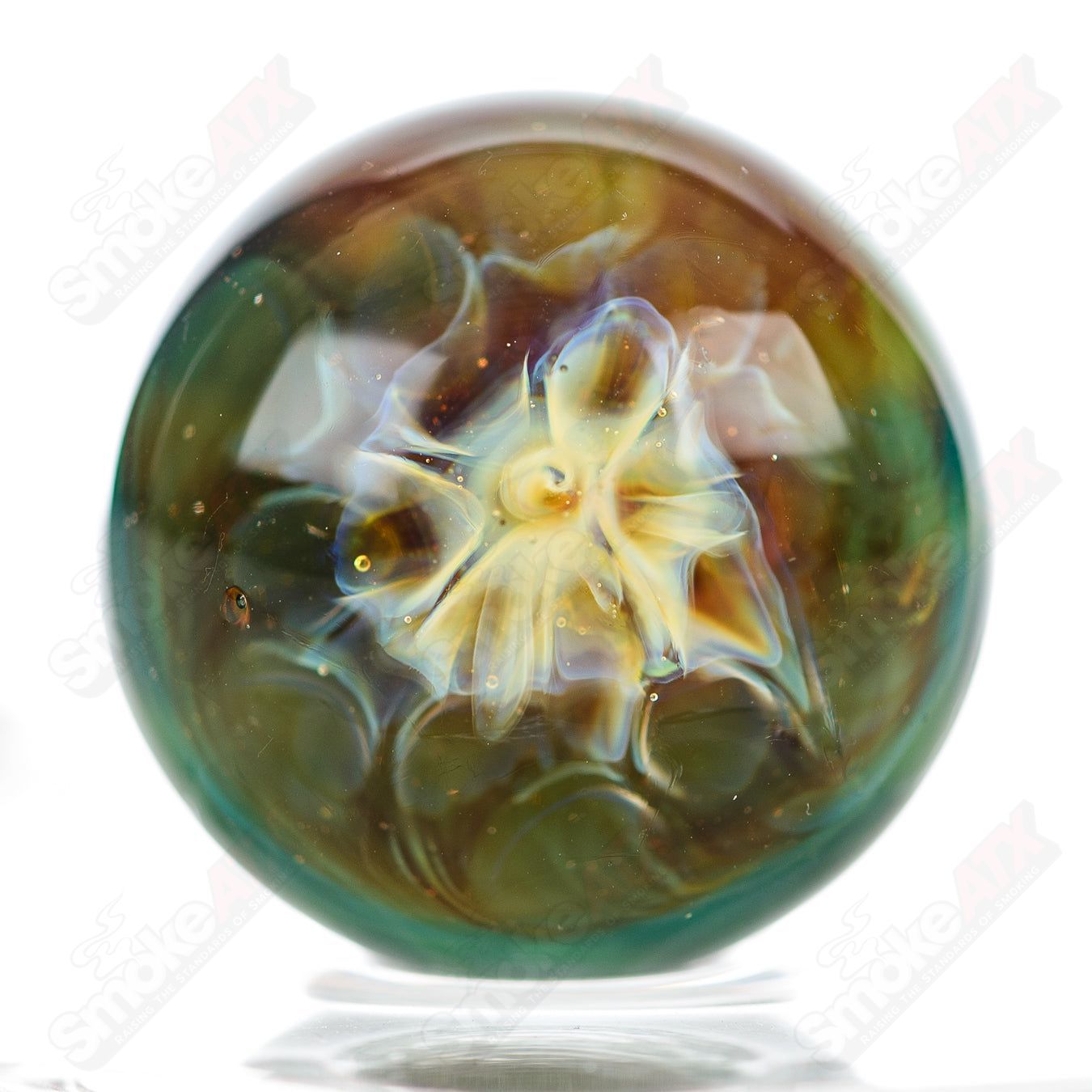 Close-up of a Phil Siegel Glass heady glass Slurper marble with intricate marbling patterns and vibrant colors.
