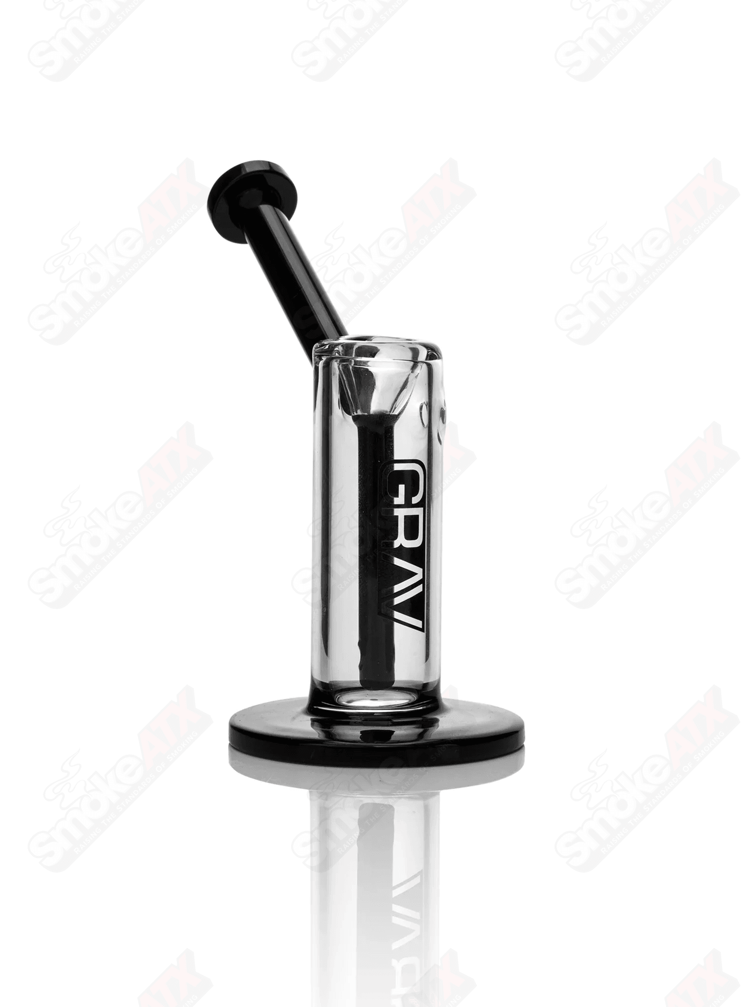 Small clear and black glass upright bubbler pipe by Grav, featuring a compact design and transparent glass body.