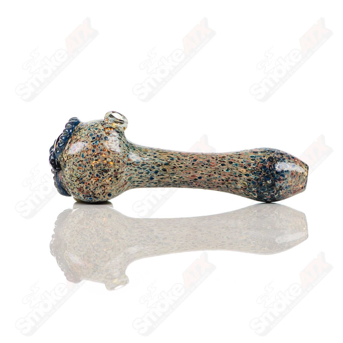Glass pipe featuring a stone frit spotted owl design by Four Winds Flameworks, showcasing intricate glasswork and vibrant colors.