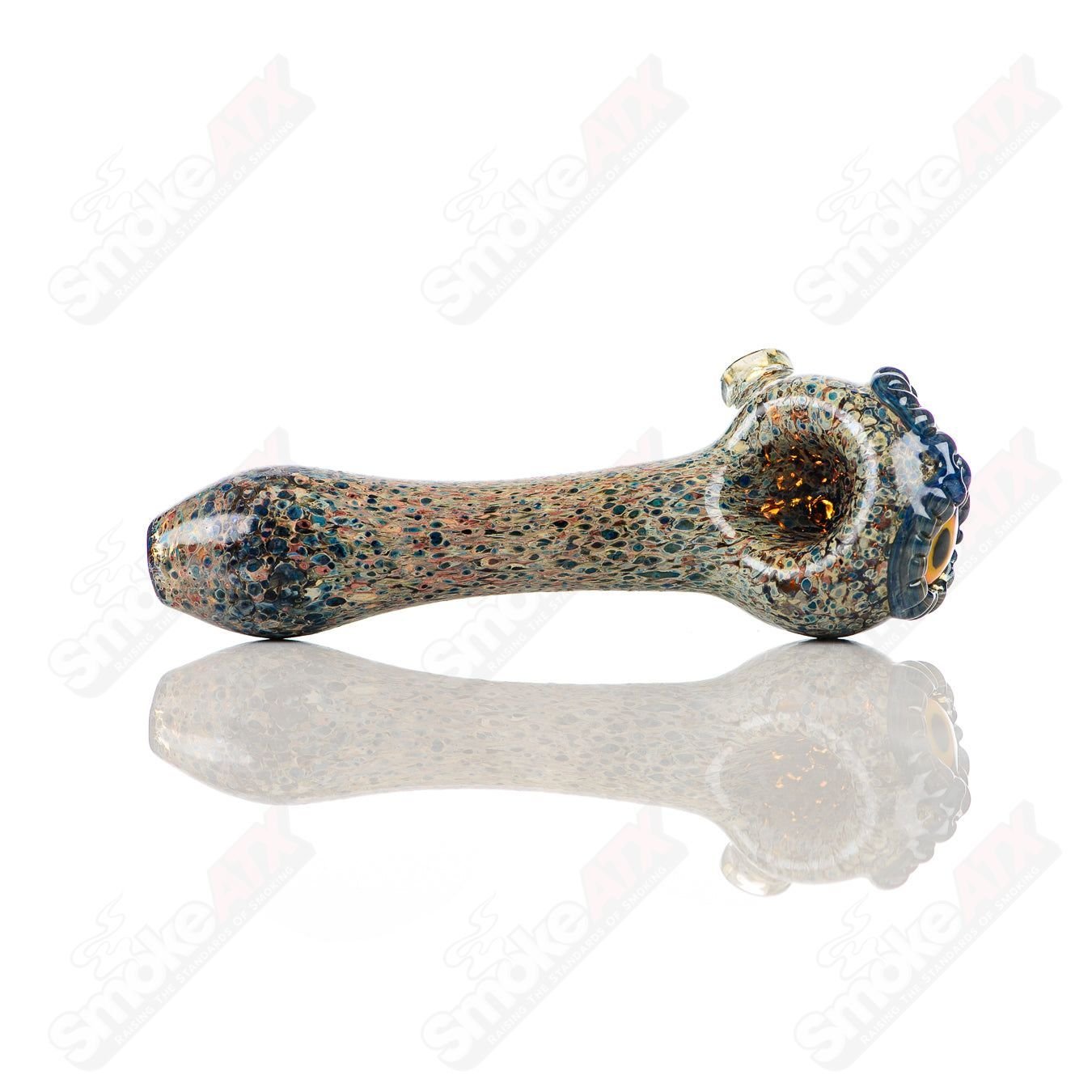 Glass pipe featuring a stone frit spotted owl design by Four Winds Flameworks, with intricate glass details and colorful accents.