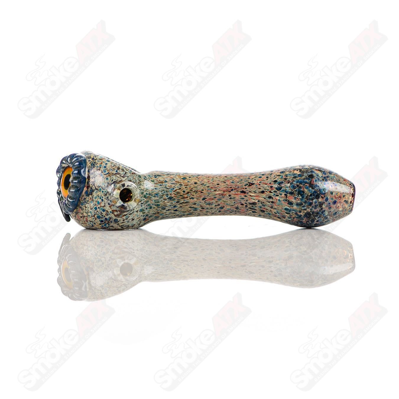 Colorful glass spoon pipe featuring a spotted owl design with stone frit accents, crafted by Four Winds Flameworks.