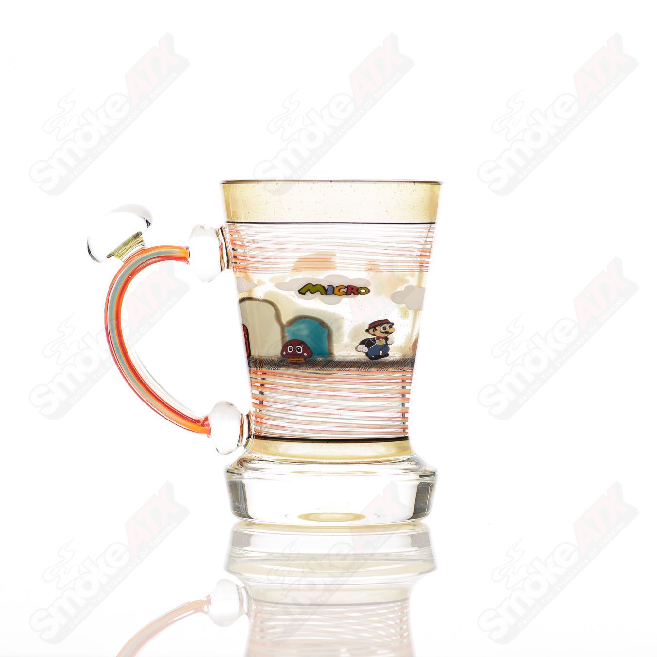 Super Mario themed Milli coffee mug by Micro Glass, featuring colorful Mario graphics on a clear heady glass cup.
