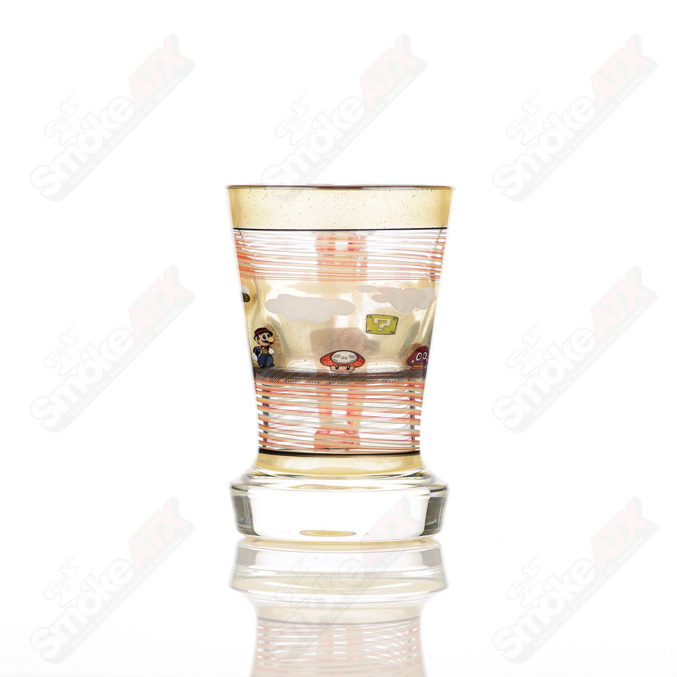 Super Mario themed Milli coffee mug by Micro & SPG, featuring colorful Mario graphics on a clear glass cup.