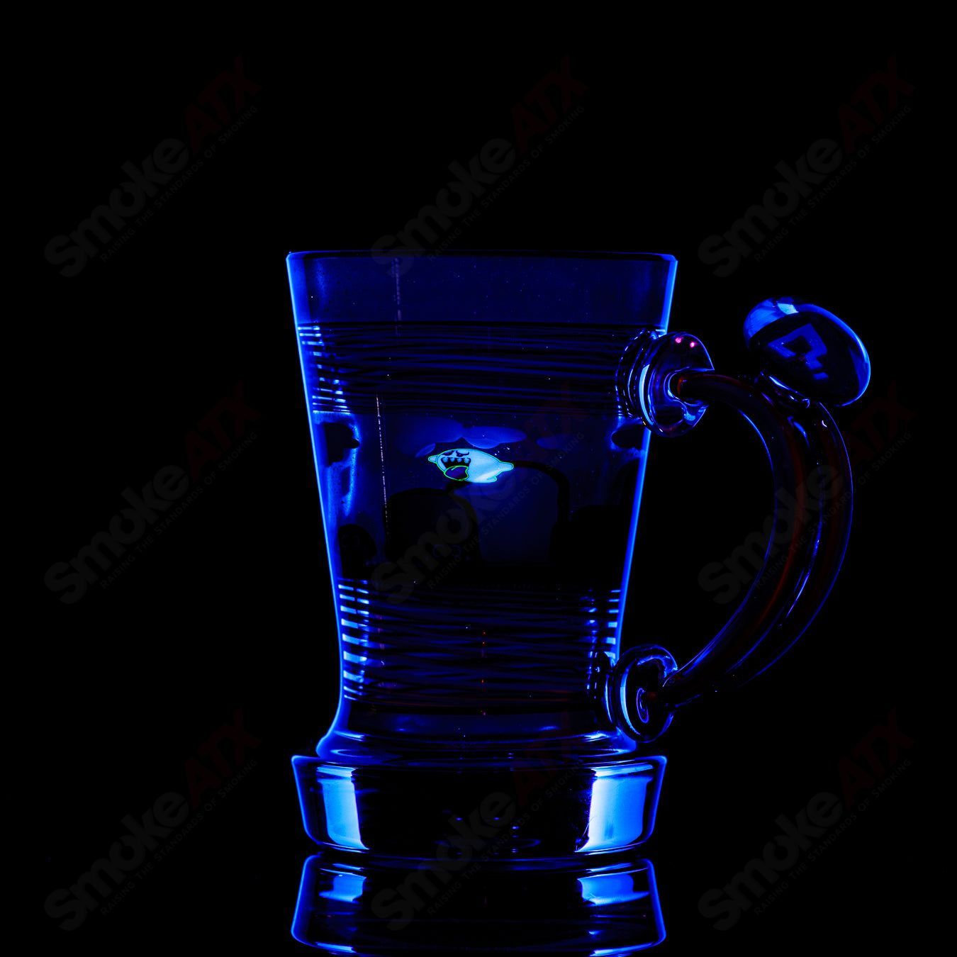 Super Mario themed Milli coffee mug by Micro & SPG, colorful heady glass cup featuring Mario characters and vibrant design.