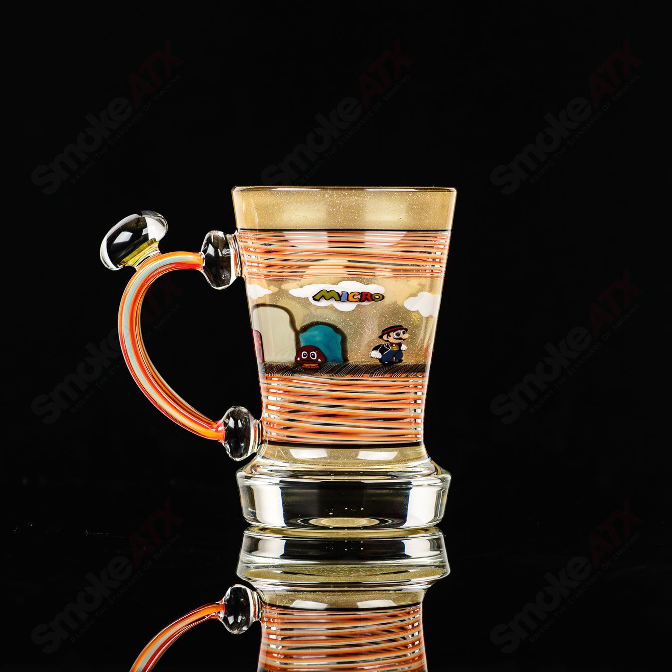 Super Mario themed Milli coffee mug by Micro & SPG, a clear glass cup with colorful Mario design, perfect for coffee or tea.