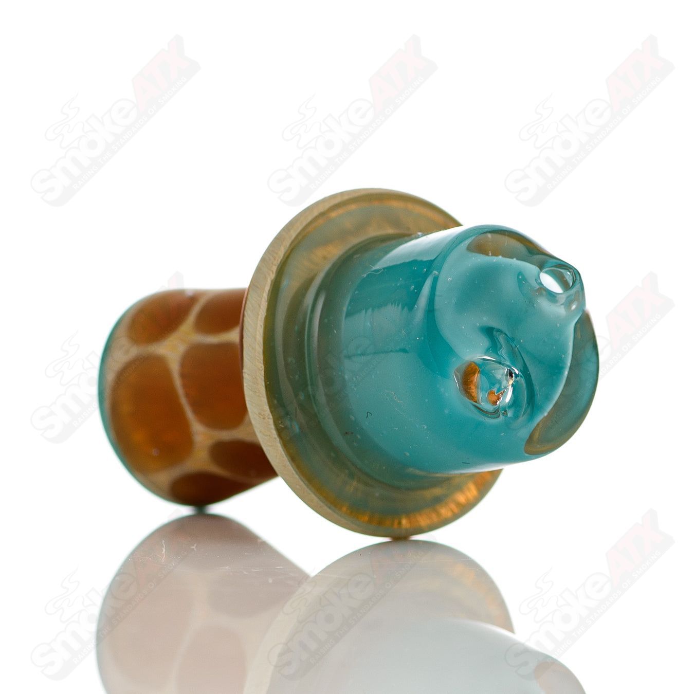 Turquoise giraffe spinner cap with pearl accents on Robertson Glass heady glass carb cap, detailed craftsmanship visible.