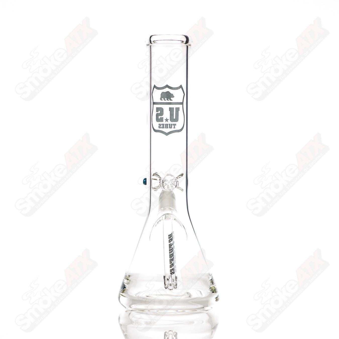 Us Tubes 12-inch glass beaker waterpipe with 50x5 constriction and black highway decal design.