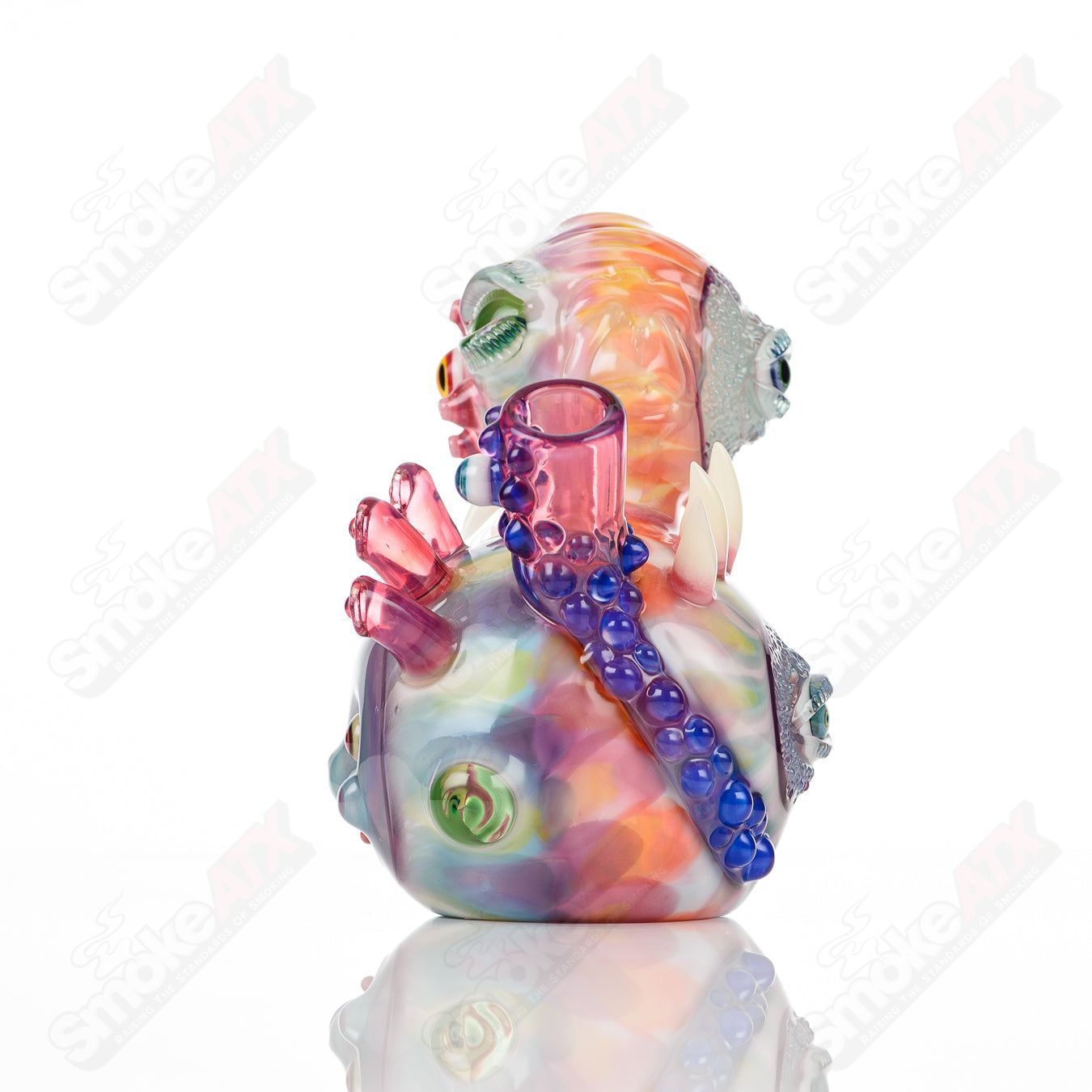 UV Saltacc Tye Dye Chappy concentrate rig by Aquarius x SALT with vibrant colors and intricate glass design.