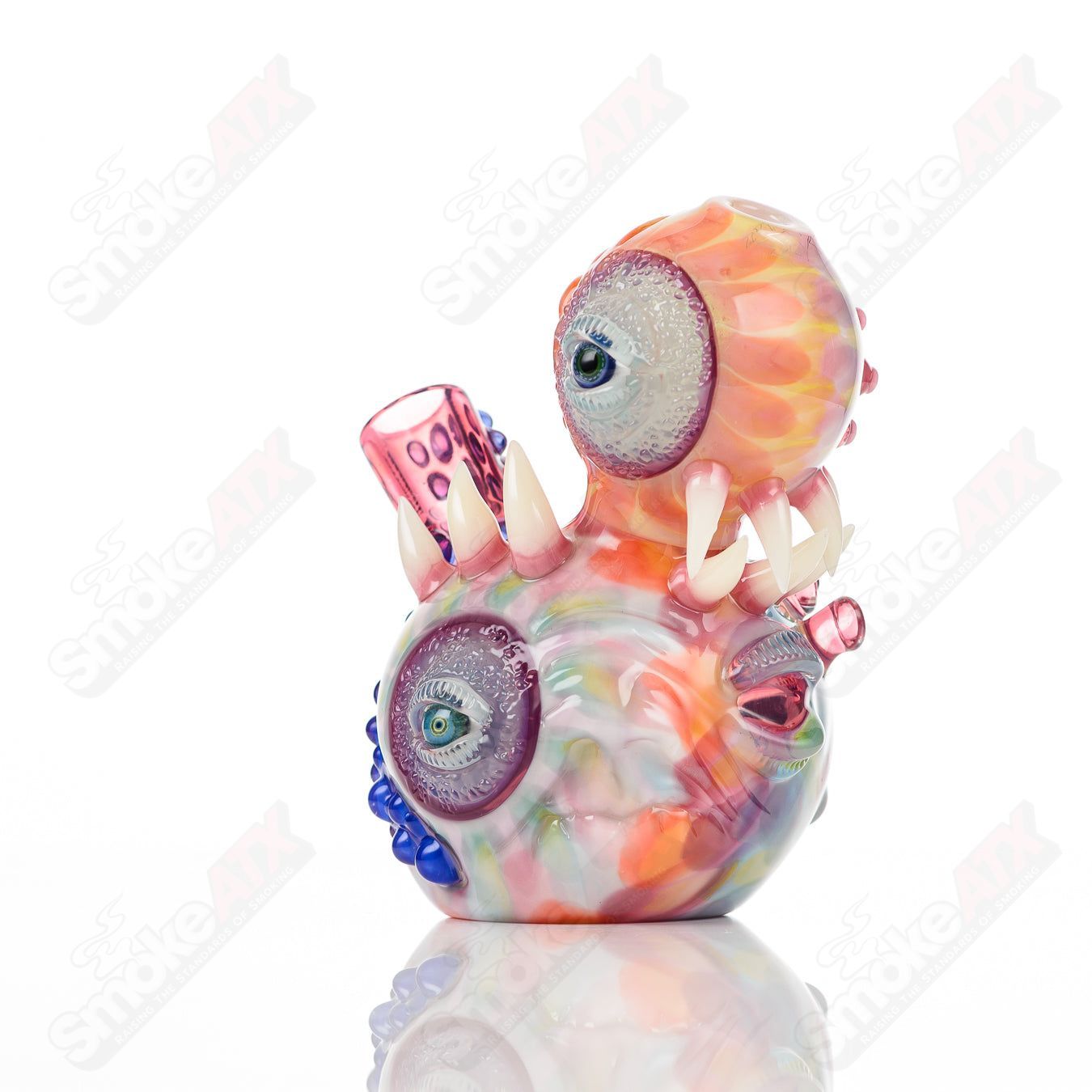 UV Saltacc Tye Dye Chappy heady glass concentrate rig by Aquarius x SALT with vibrant colors and intricate floral and celestial designs.
