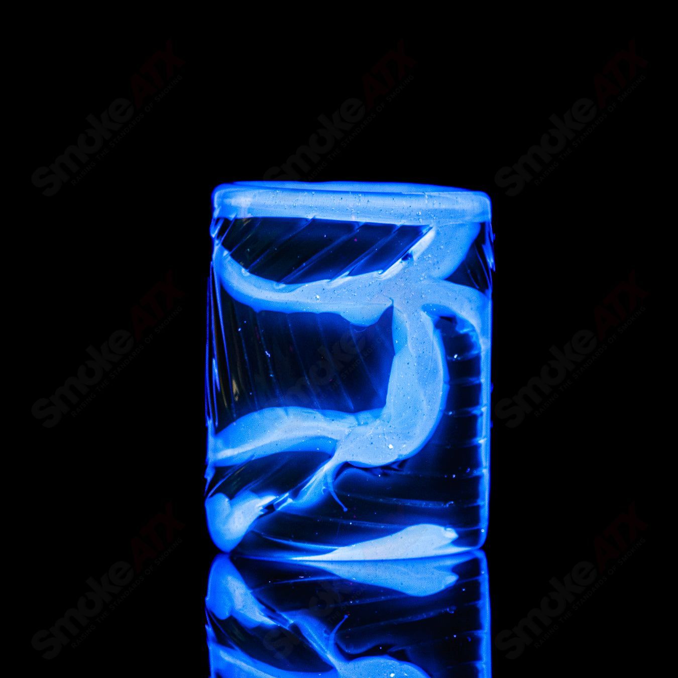 UV Salty Eye shot glass with teeth design by Salt Glass, featuring vibrant colors and a playful, spooky eye motif.