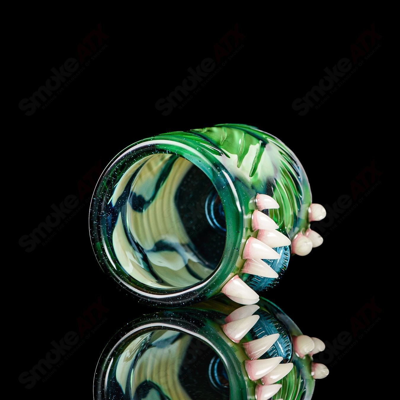 UV Salty Eye Shot Glass with Teeth by Salt Glass, a colorful heady glass cup featuring a unique salty eye design and teeth detail.