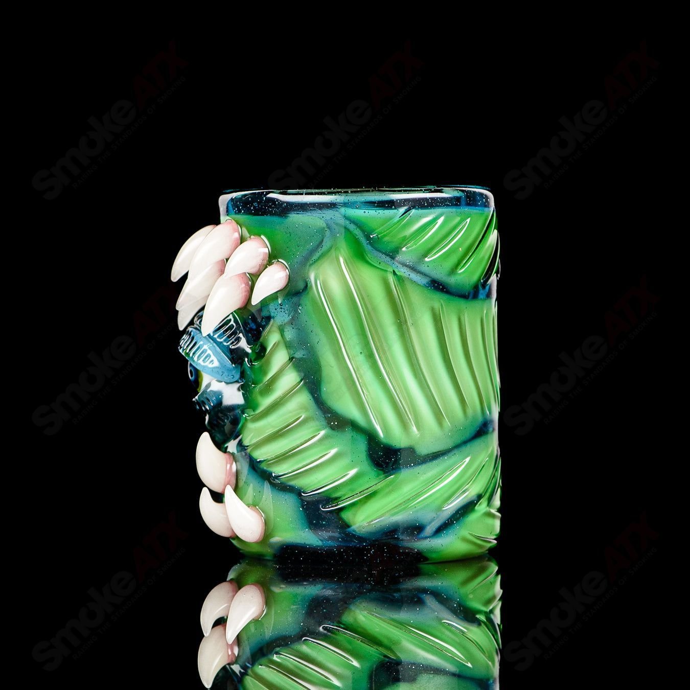 UV Salty Eye Shot Glass with Teeth by Salt Glass, colorful heady glass cup featuring a salty eye design with teeth.