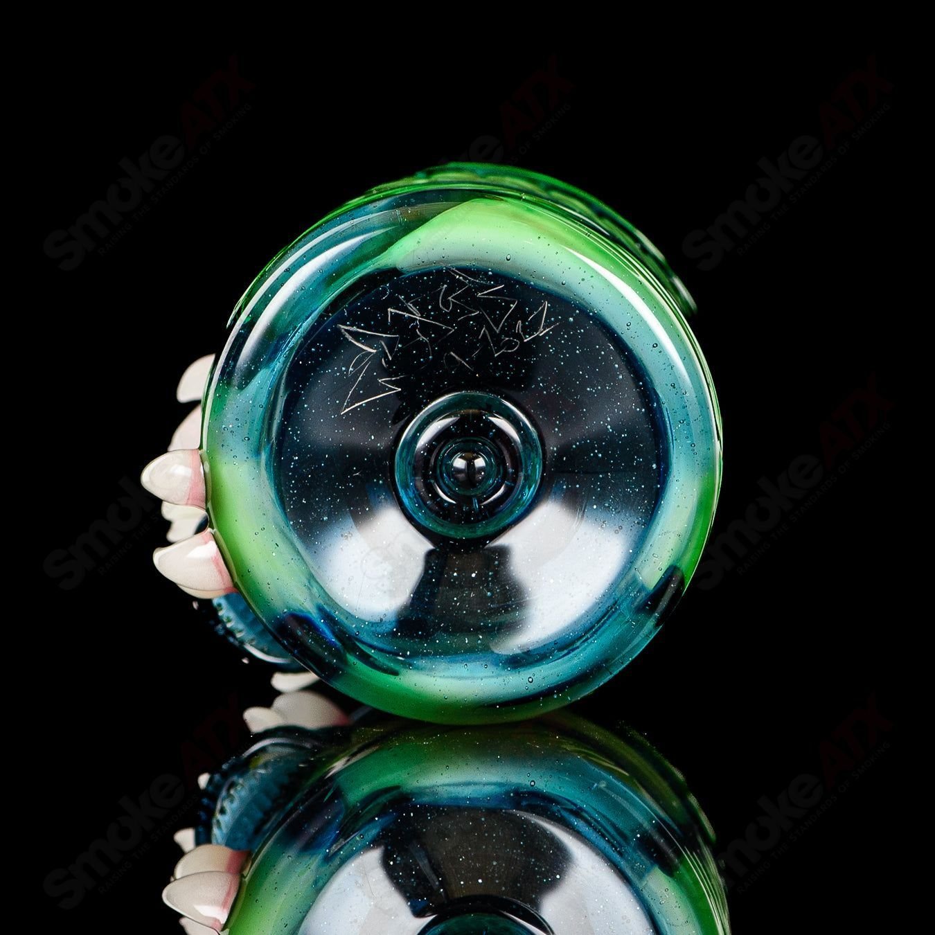 UV Salty Eye Shot Glass with Teeth by Salt Glass, a colorful heady glass cup featuring a salty eye design with teeth.