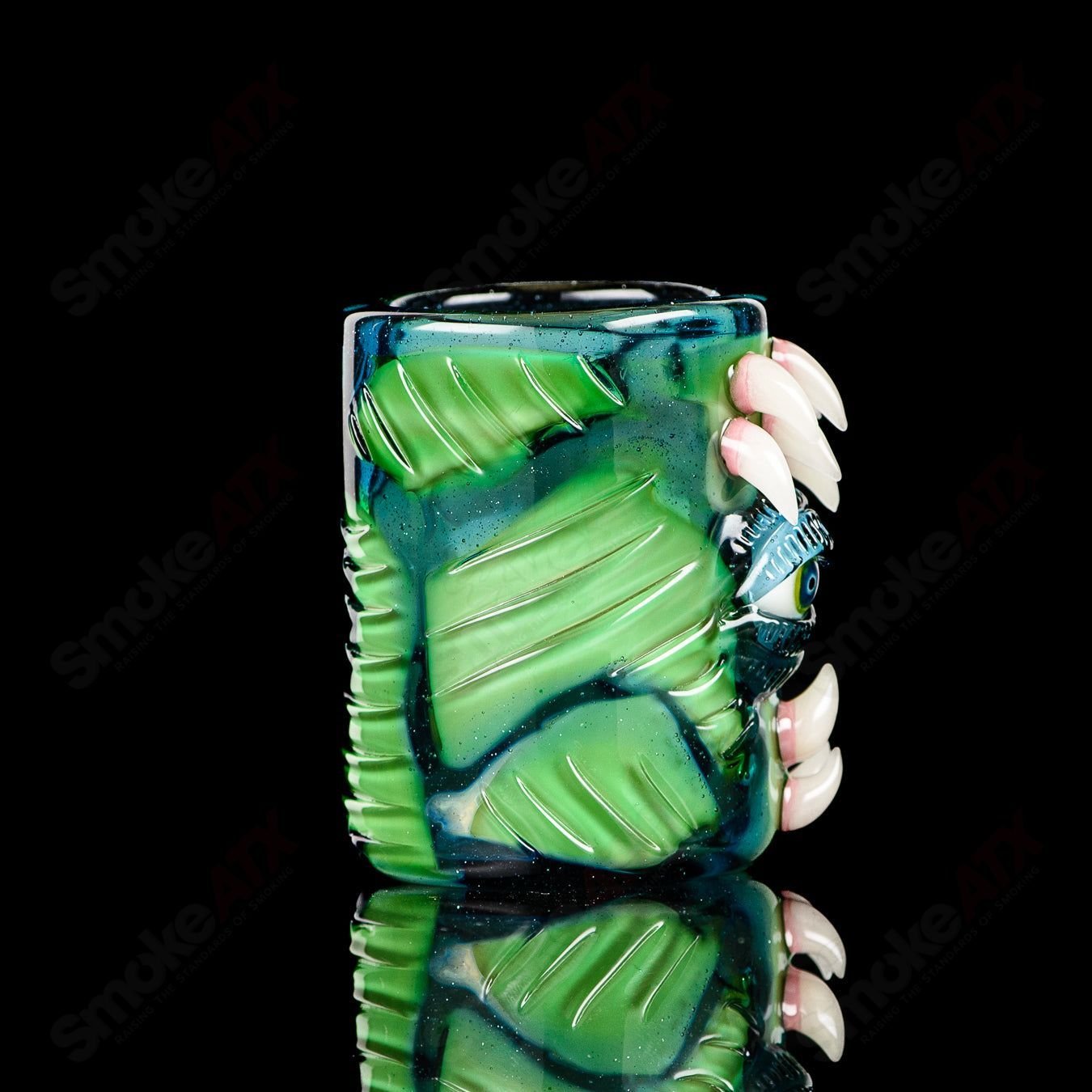 UV Salty Eye Shot Glass with Teeth by Salt Glass, a colorful heady glass cup featuring a unique eye and teeth design.