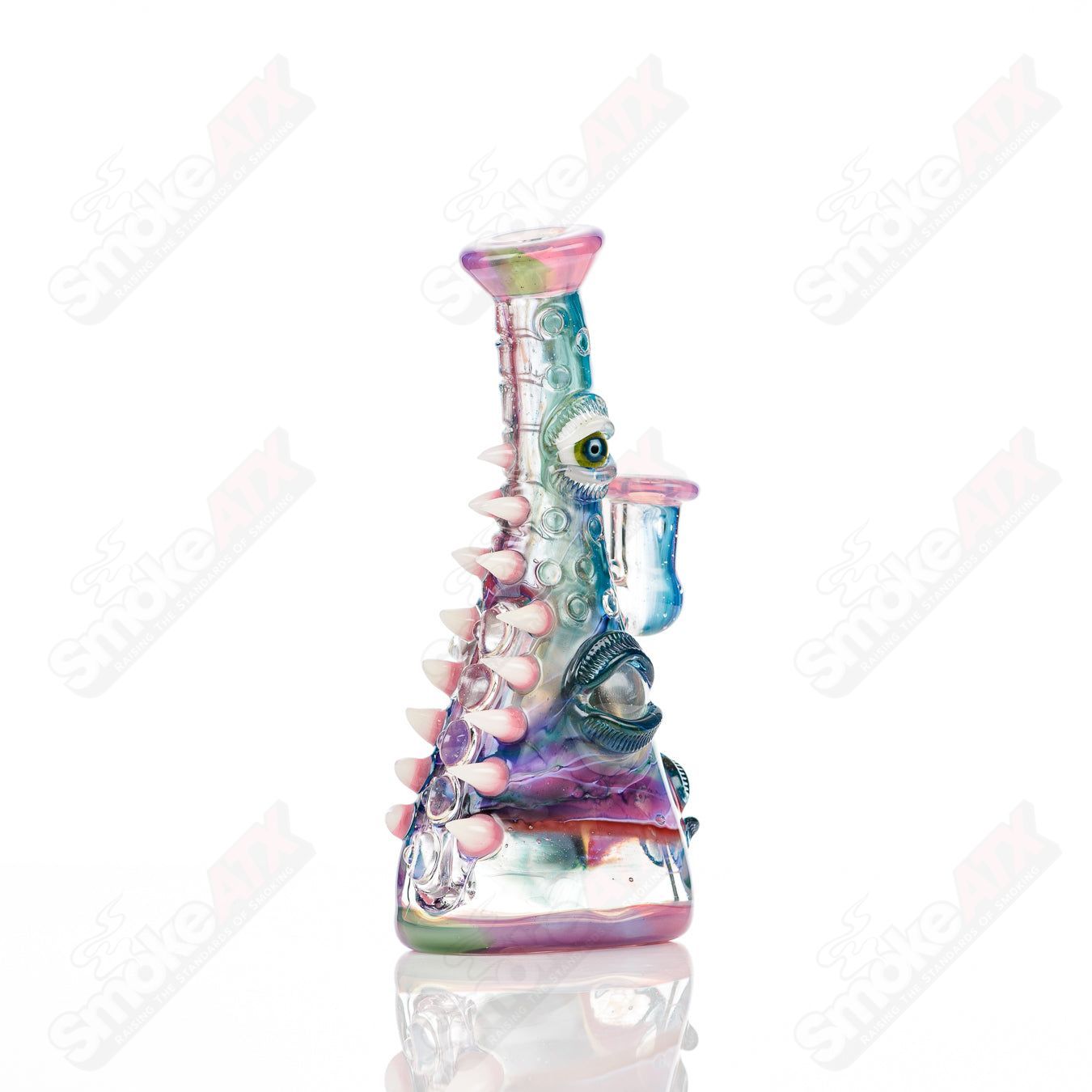 UV tie-dye Soul Flask glass by Nobody x SALT, a colorful concentrate rig with vibrant tie-dye design and clear glass construction.