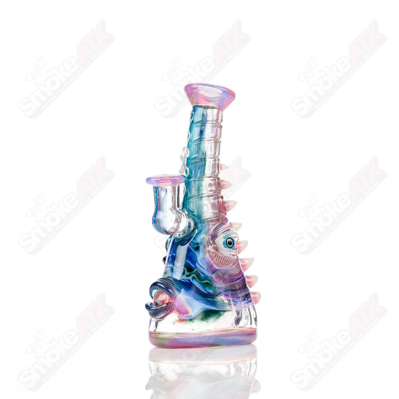 UV tie-dye glass Soul Flask by Nobody x SALT, a colorful heady glass concentrate rig with vibrant tie-dye design.