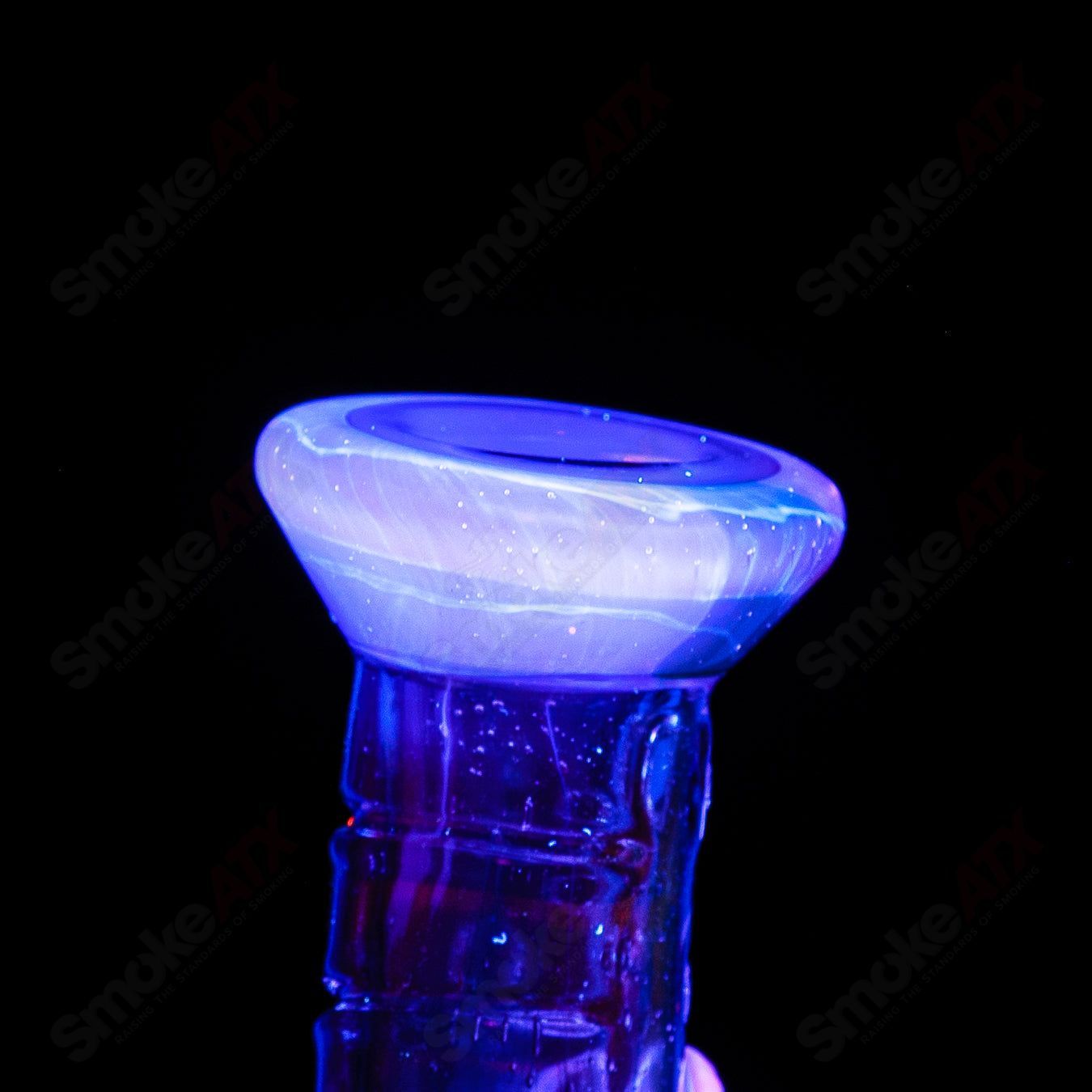 UV tie-dye Soul Flask glass by Salt Glass, a colorful concentrate rig with vibrant tie-dye design and UV-reactive features.