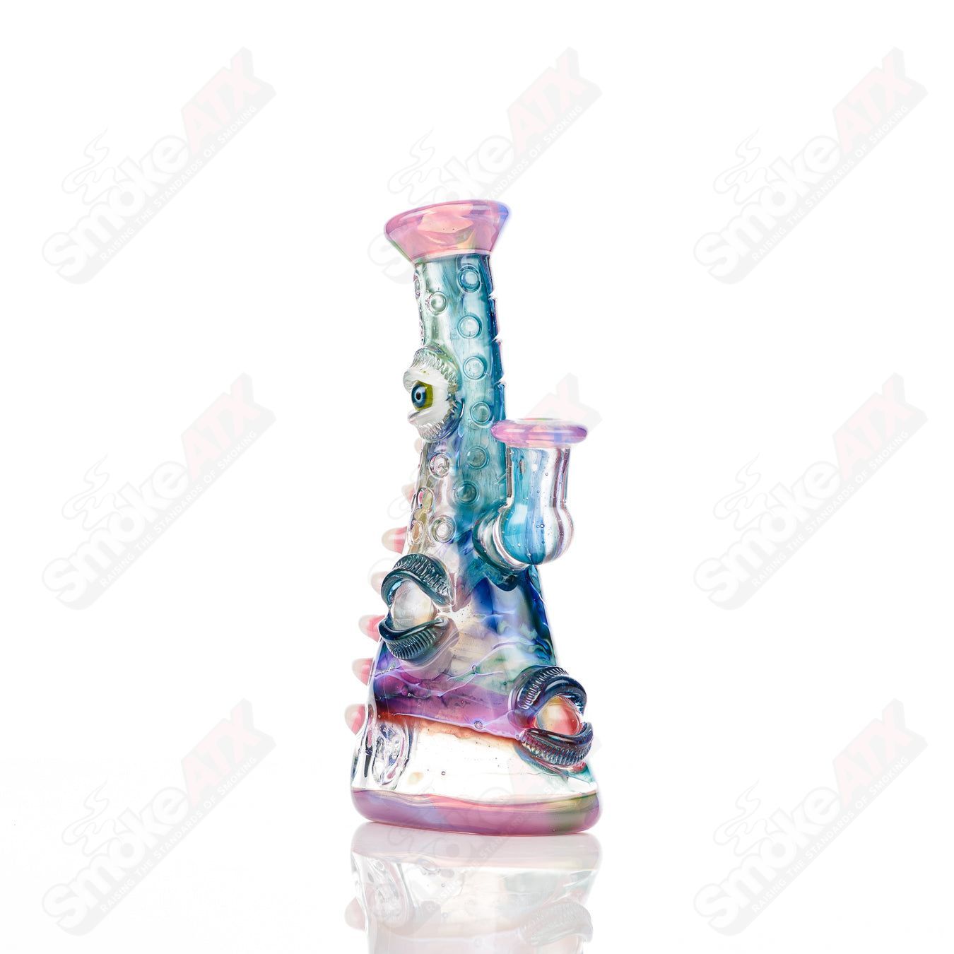 UV tie-dye Soul Flask glass by Nobody x SALT, a colorful concentrate rig with vibrant tie-dye design and UV-reactive features.