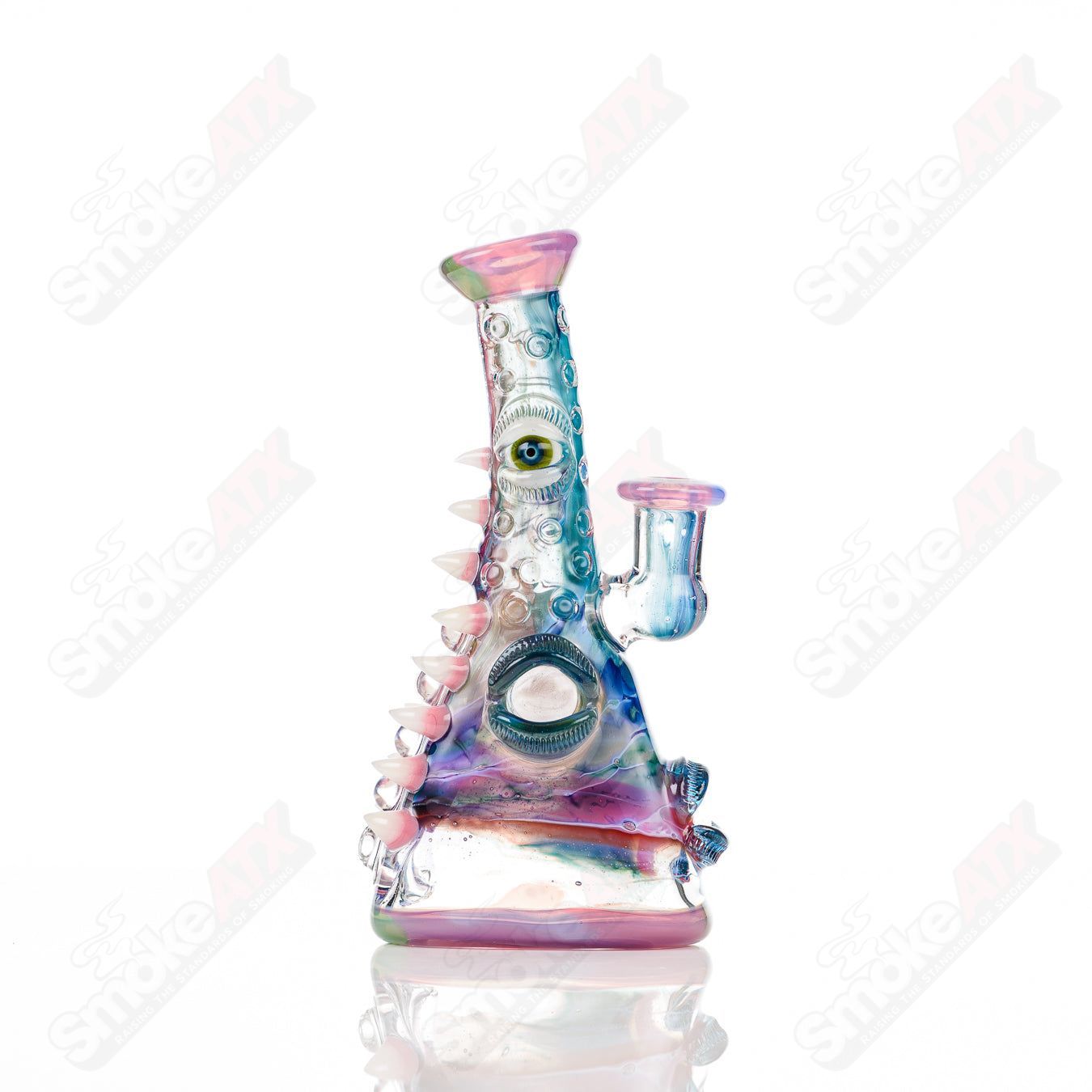 UV tie-dye glass concentrate rig called the Soul Flask by Nobody x SALT, featuring vibrant colors and intricate glasswork.