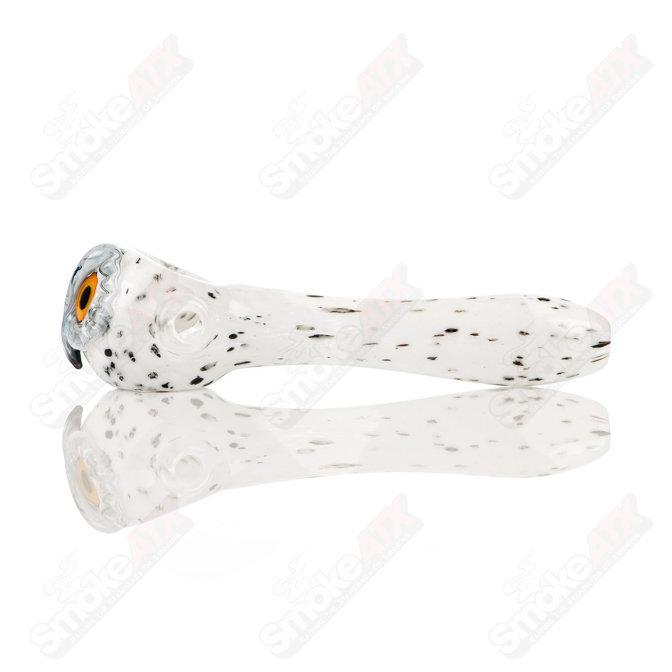 White spotted owl glass spoon pipe by Four Winds Flameworks, featuring detailed owl design and clear glass construction.