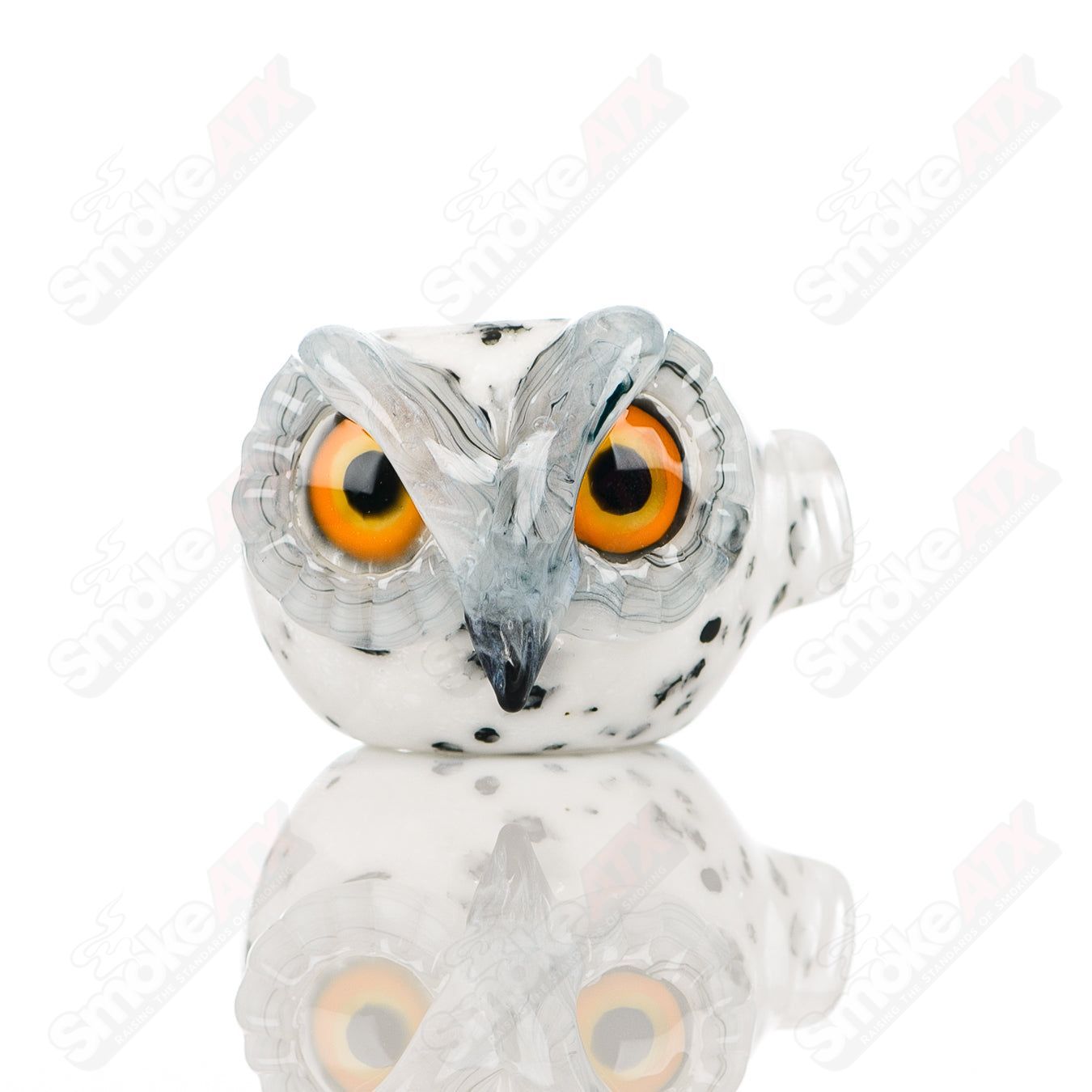 White spotted owl glass spoon pipe by Four Winds Flameworks featuring detailed owl design and clear glass craftsmanship.