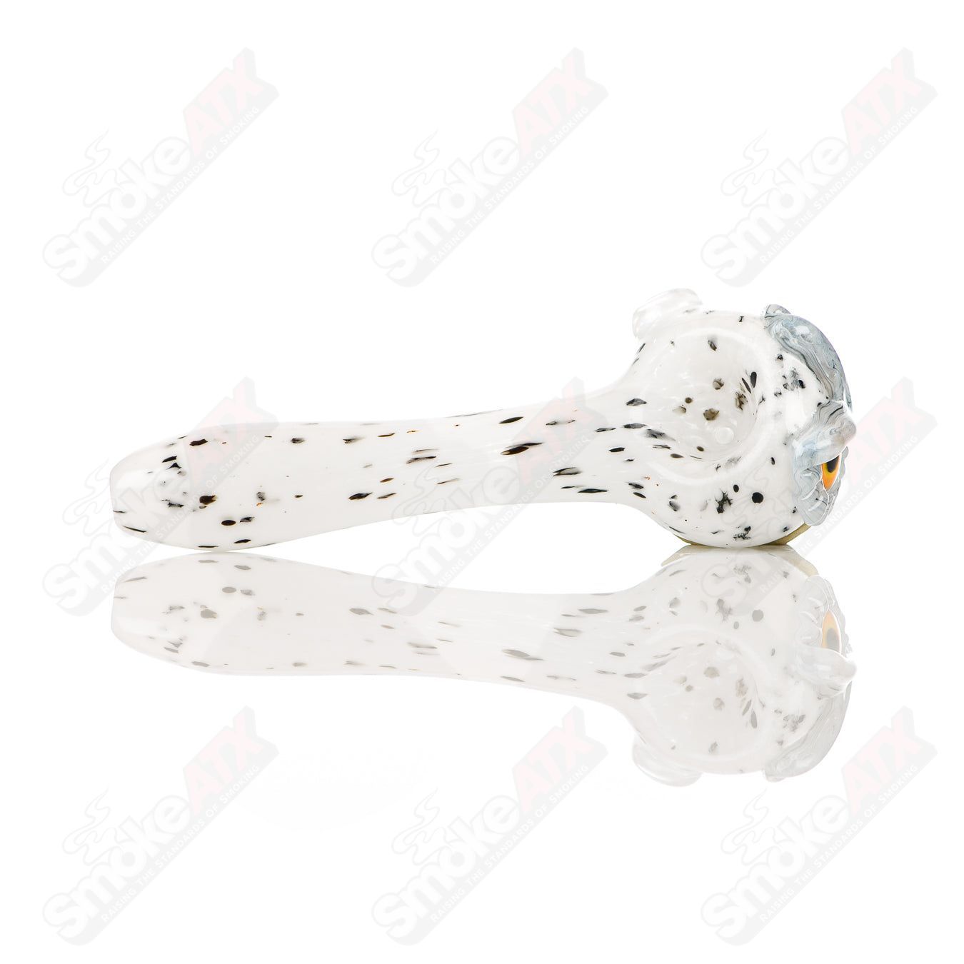 White spotted owl glass spoon pipe by Four Winds Flameworks, featuring detailed owl design and clear glass craftsmanship.