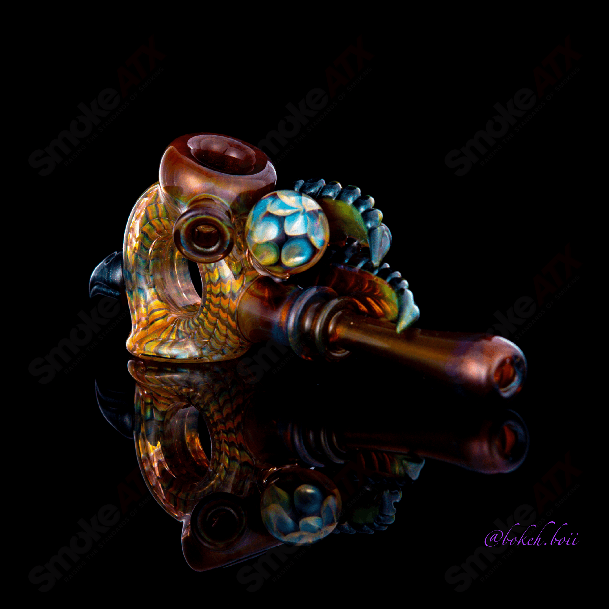 Calmbo Wrap And Rake Dry Pipe by Heady Glass, featuring intricate glass design and a compact hand pipe for easy use.